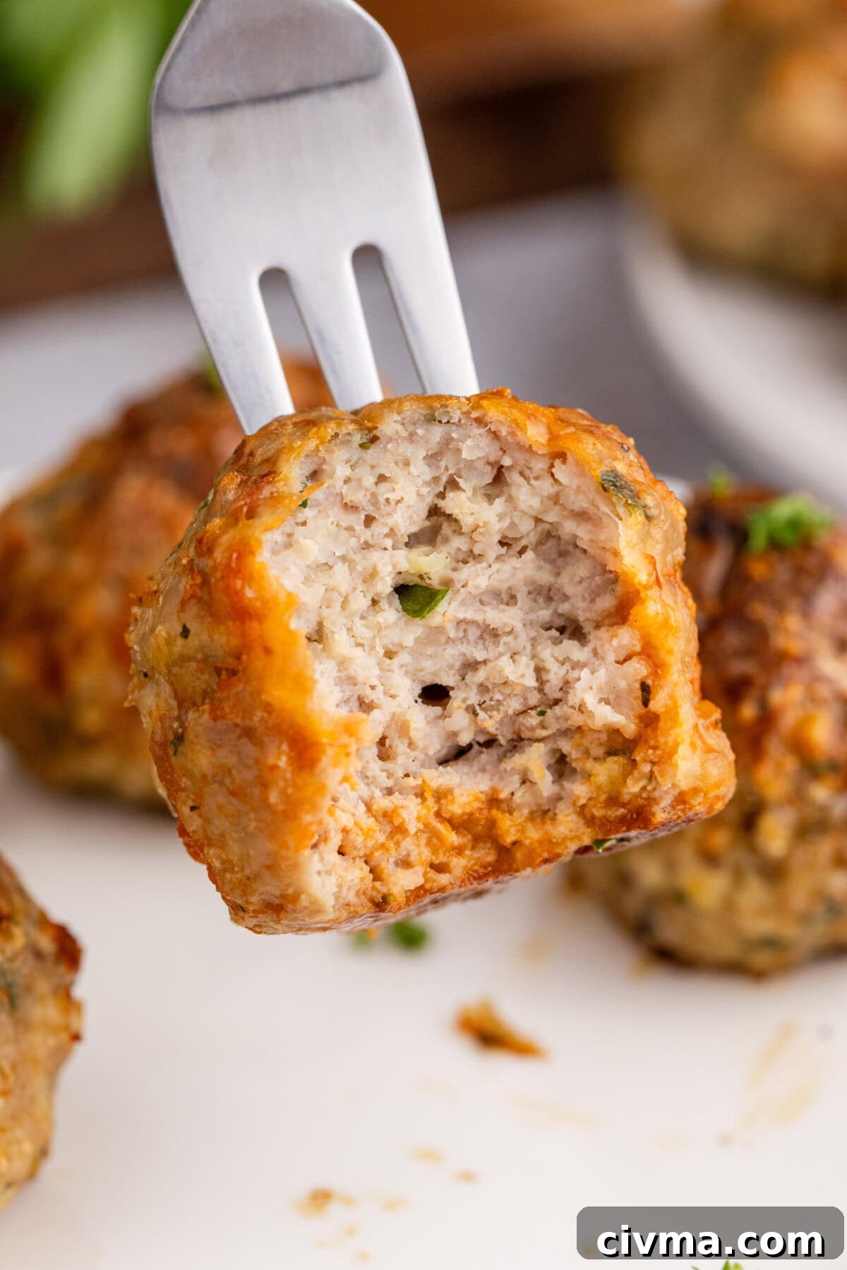 Chicken Meatball on a fork with a bite taken out