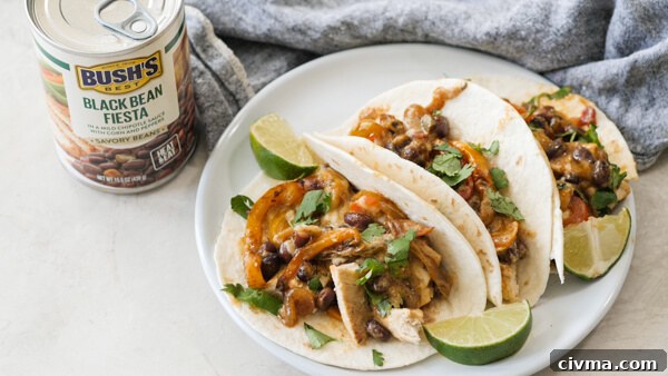 Chicken Fajita Casserole -- easy weeknight recipe with fajita veggies, black beans, sour cream and cheese on chicken breasts & baked in a cast iron skillet.