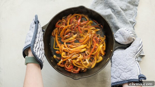 cooked fajita veggies in cast iron