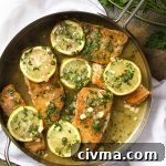 Salmon piccata with lemon and caper sauce pan seared in a skillet and served over pasta for an easy dinner.