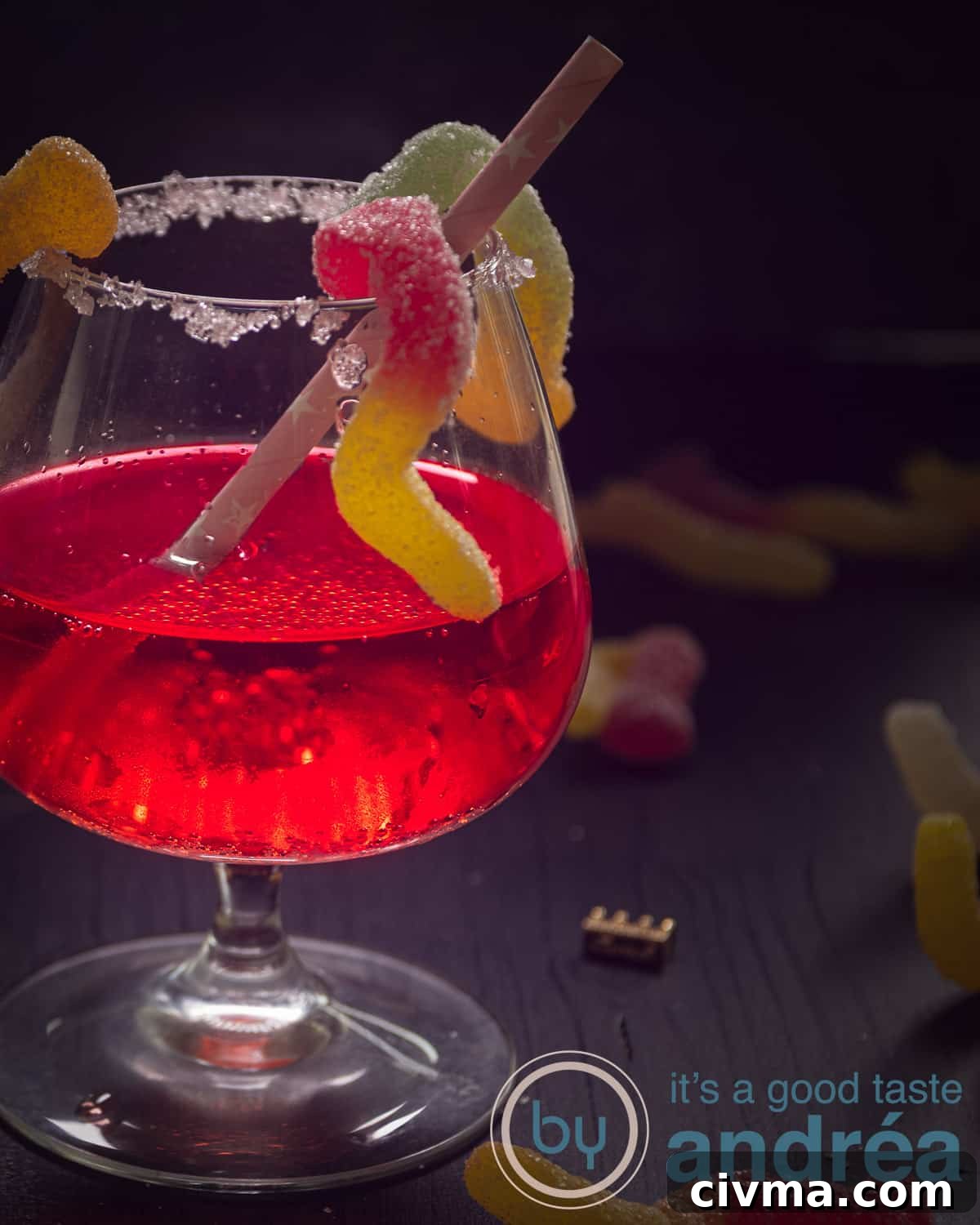 Part of a Passoa Halloween Cocktail, worms climbing up. A dark background