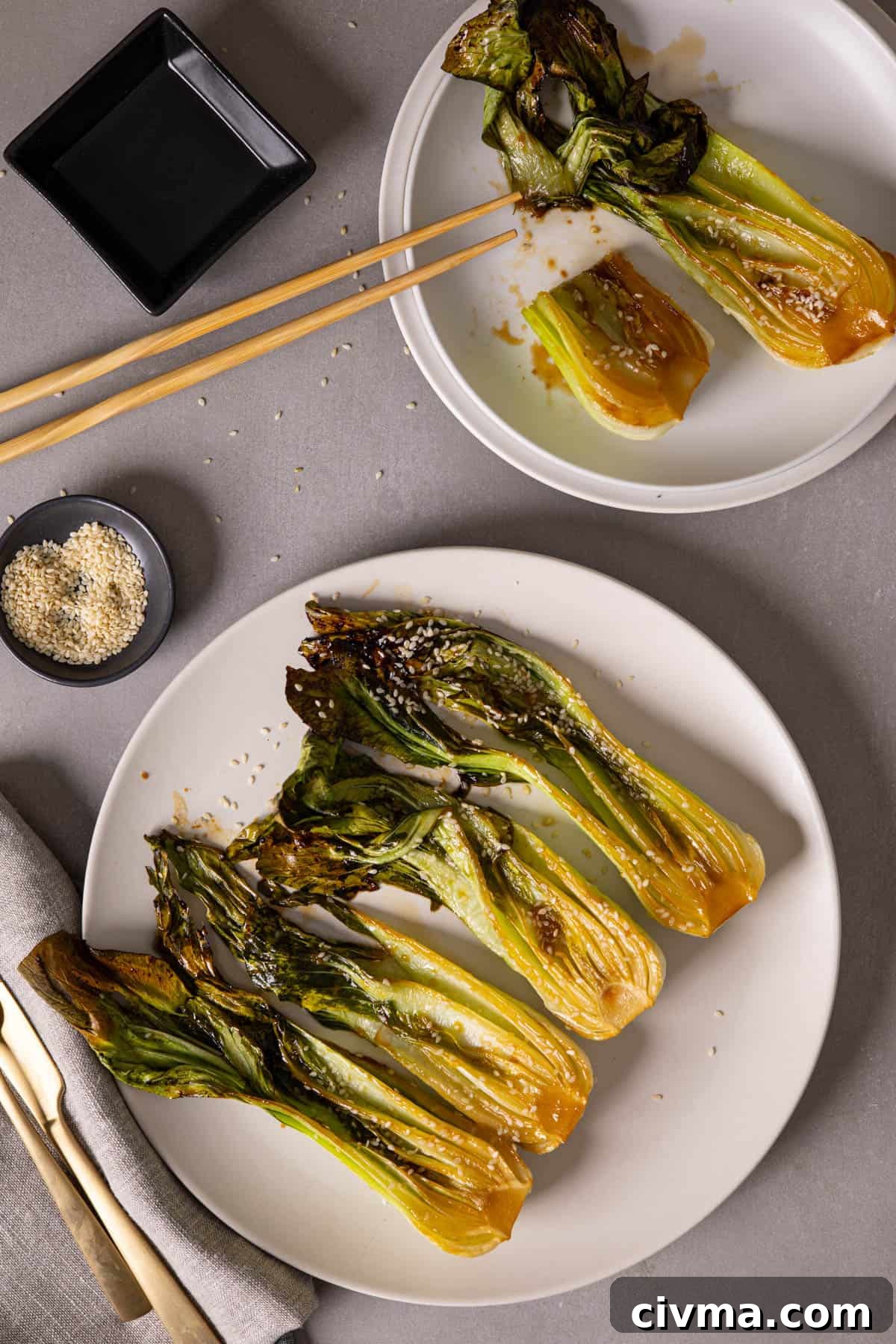 Roasted Bok Choy Recipe with Garlic and Sesame 9 A platter of roasted bok choy with a serving to the side.