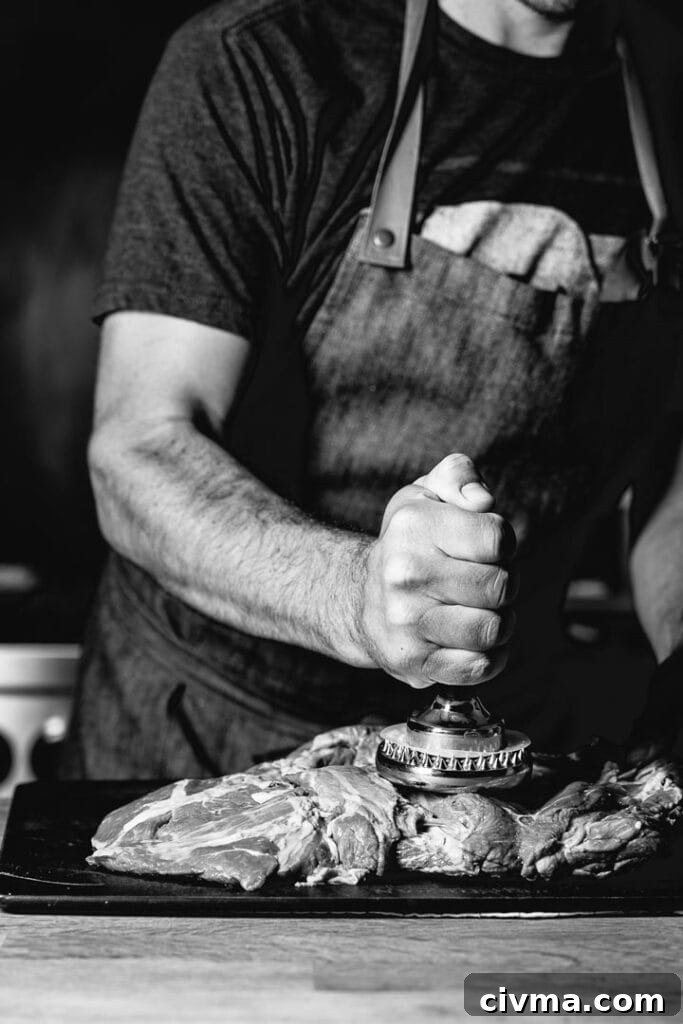 flattening leg of lamb with meat pounder