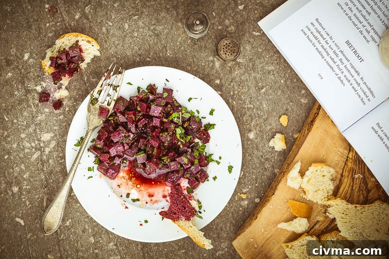 A colourful beetroot and mint salad with pomegranate molasses dressing, ideal as a quick vegetarian side dish.