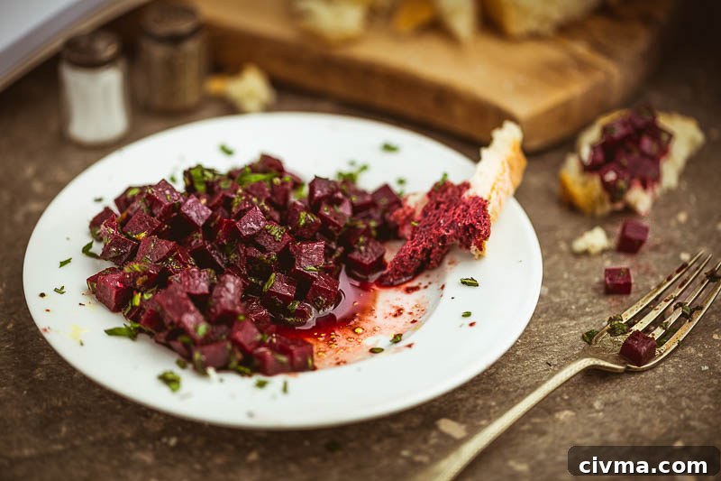 Beetroot and mint salad with pomegranate dressing served as a quick vegetarian side dish.
