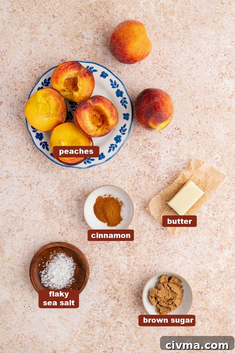All of the ingredients for grilled peaches on a countertop in prep bowls including fresh peaches, butter, brown sugar, cinnamon and salt.