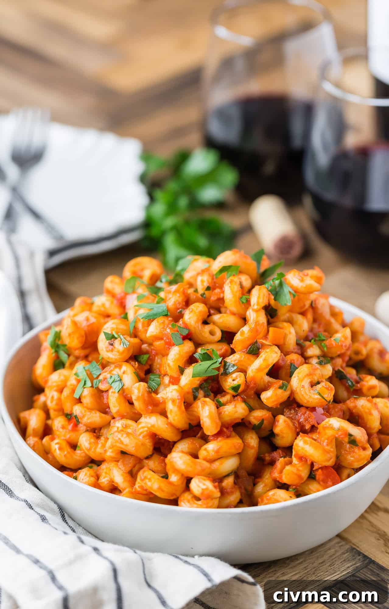 Pasta with pancetta and tomato sauce in bowl.