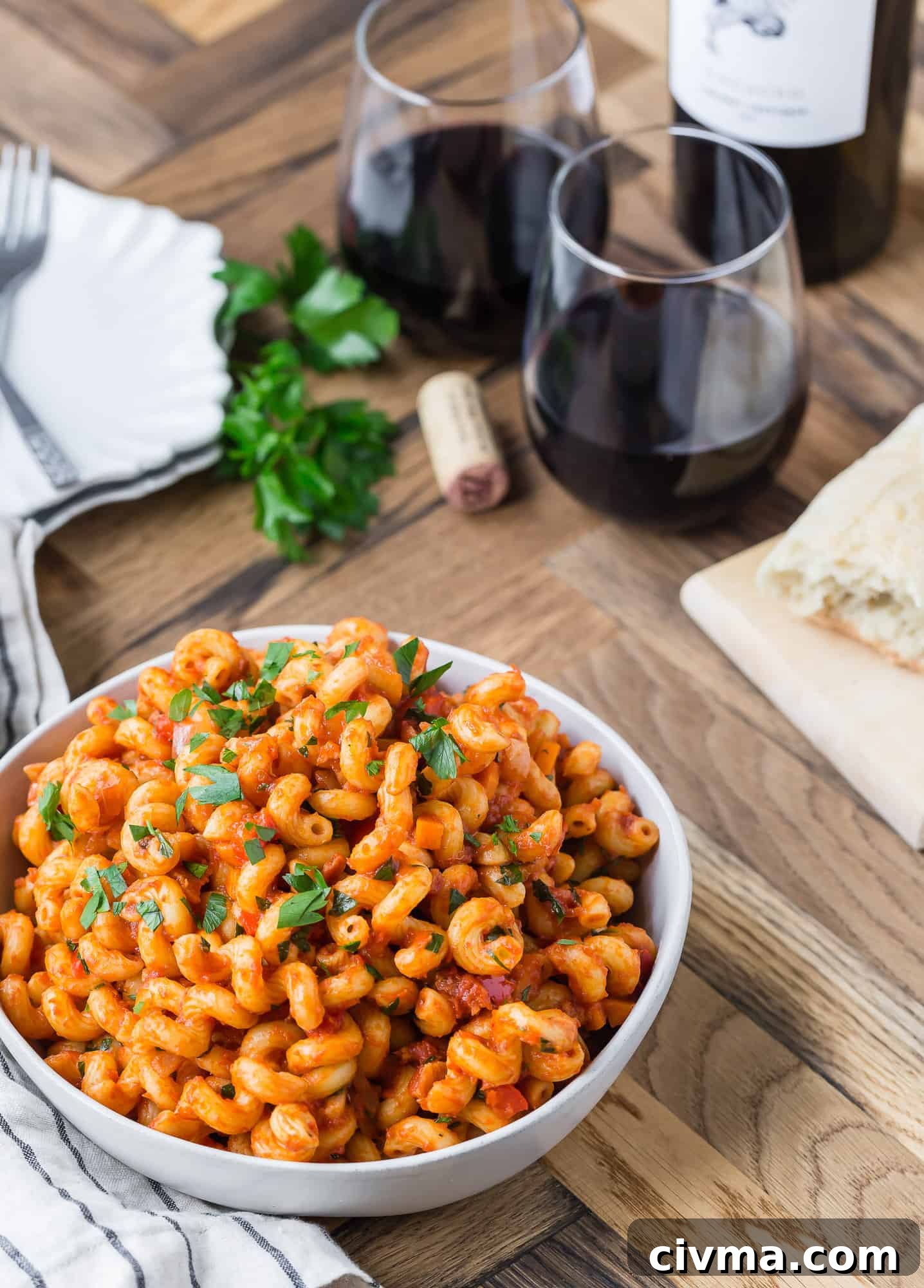 Pasta in a tomato sauce in white bowl.