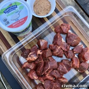 Seasoned sirloin steak cubes ready for yogurt marinade
