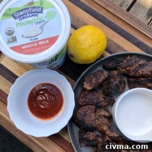 Grilled yogurt marinated sirloin steak tips resting after cooking
