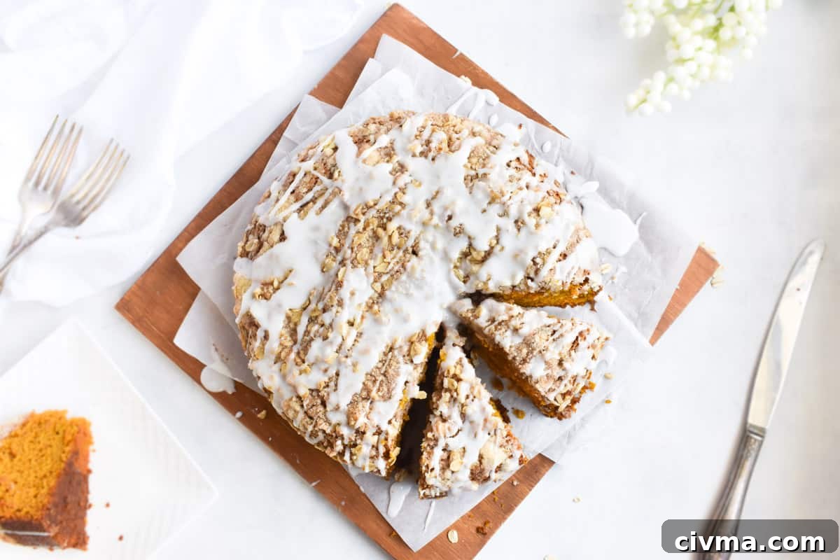 whole coffee cake sliced into pieces on cutting board. 