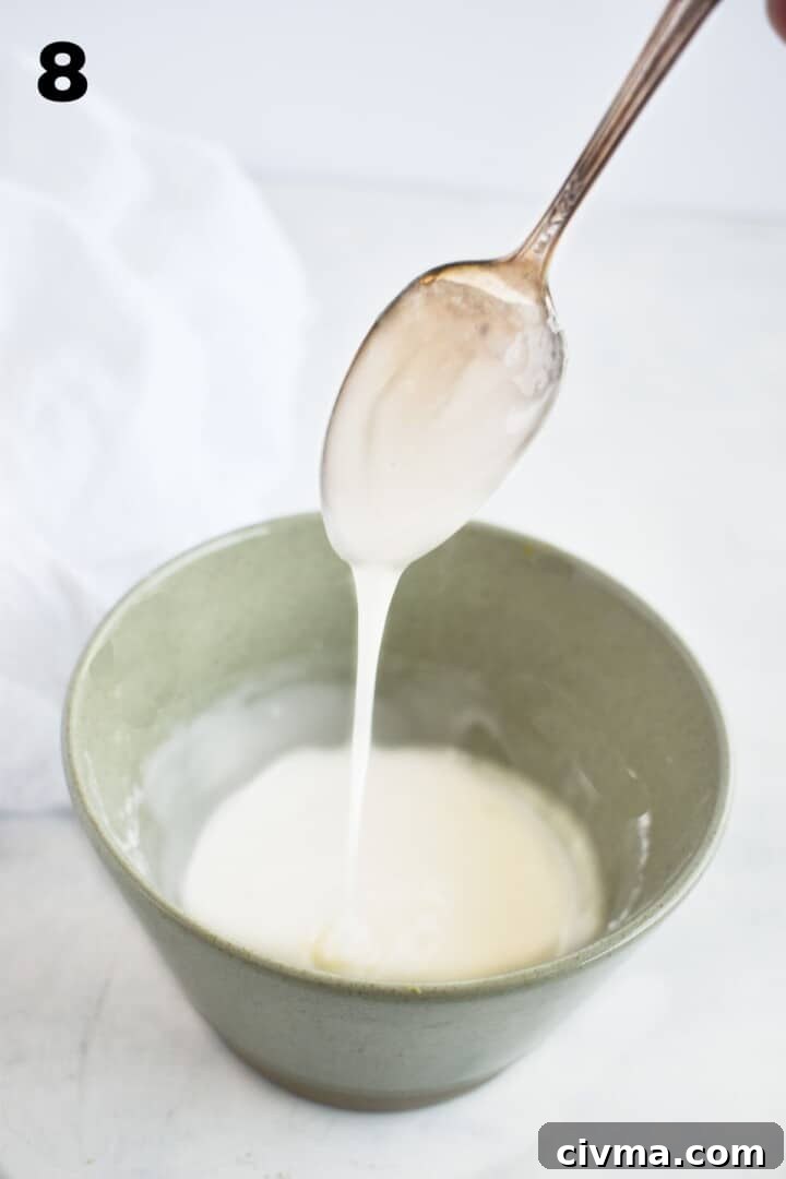 spoon drizzling glaze over bowl. 