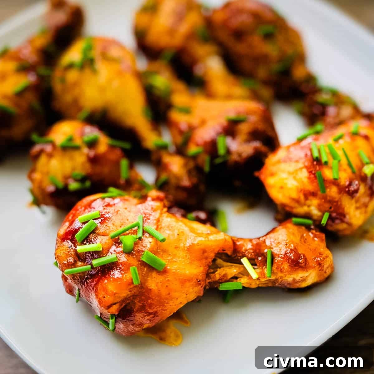 A plate filled with BBQ chicken legs cooked in the Instant Pot.