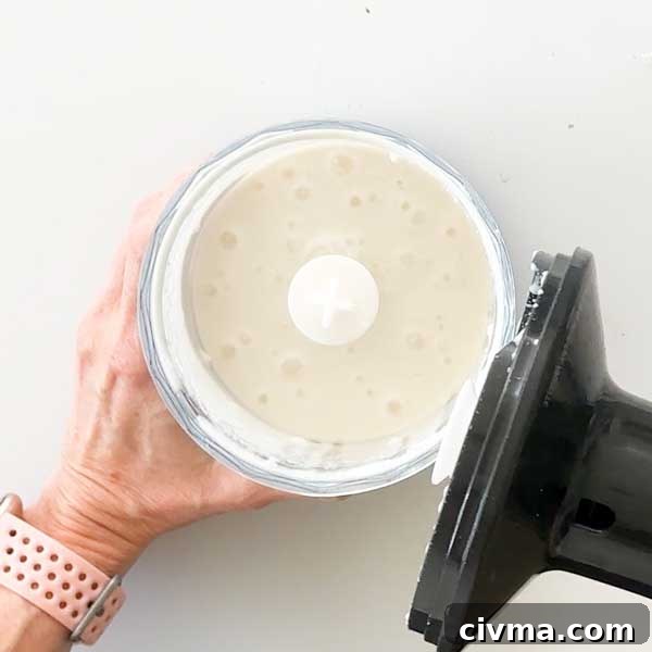 Creamy Garlic Cottage Cheese Mashed Potatoes 12 The blended cottage cheese and wet ingredients in a chopper cup.