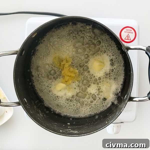 Creamy Garlic Cottage Cheese Mashed Potatoes 14 Melting the butter and garlic in a saucepan.