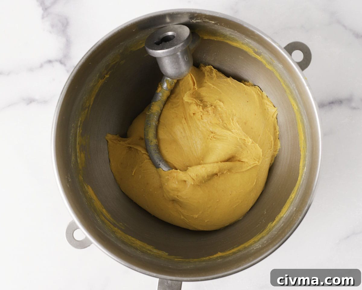 Soft Pumpkin Dinner Rolls Recipe 7 Pumpkin dough coming together in a stand mixer.