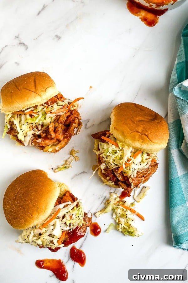 small sandwiches with barbecue sauce and cole slaw
