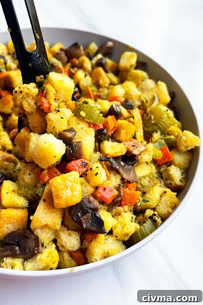 Instant Pot Vegetarian Stuffing Recipe 4 Easy Mushroom Stuffing in Gray Bowl With Black Spoon
