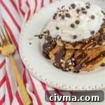 Easy Christmas Pancakes on a white plate with whipped cream