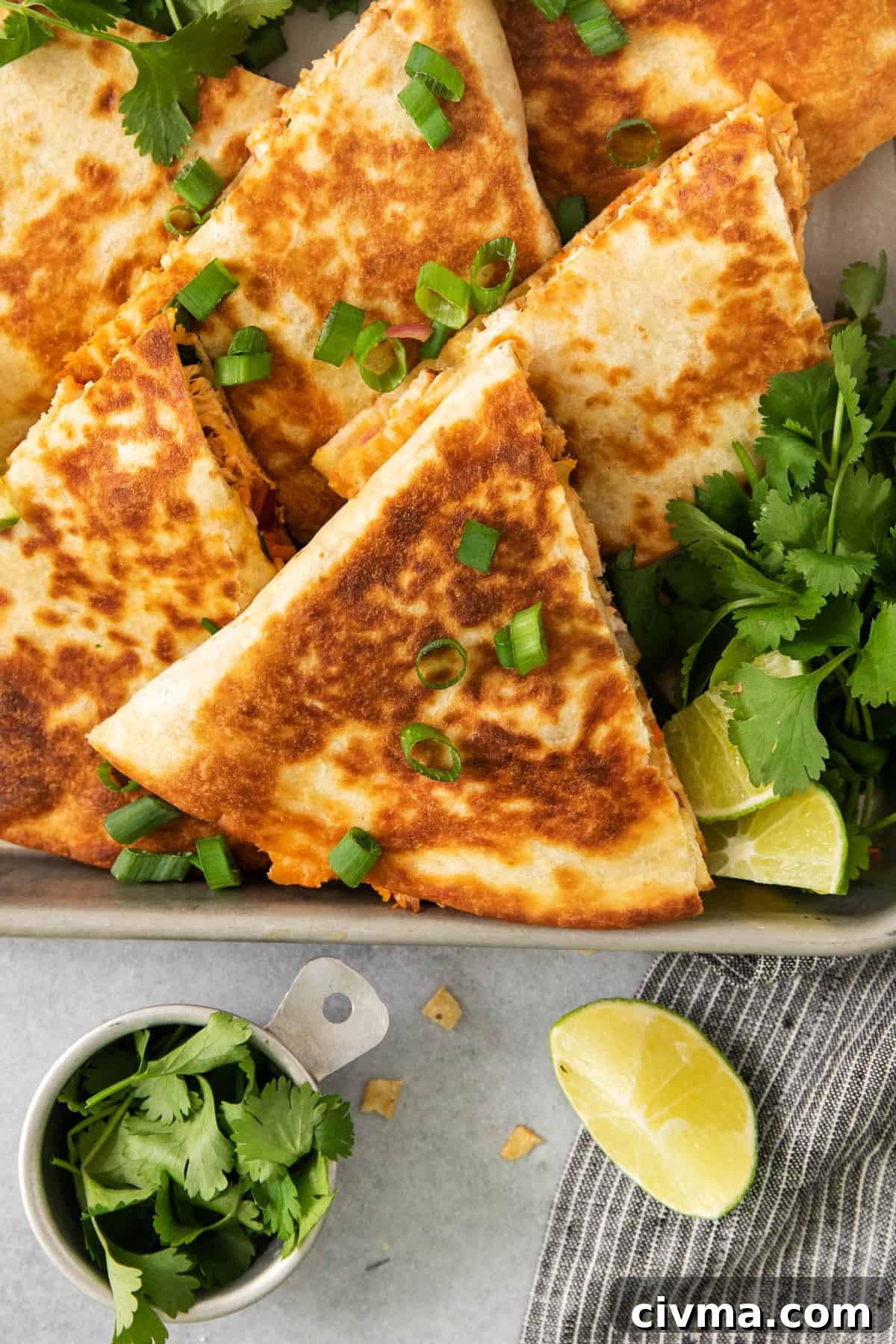 Buffalo Chicken Quesadilla Recipe 5 Chicken quesadillas on a baking sheet.