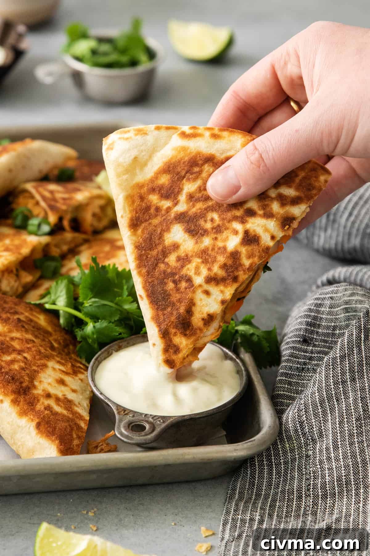 Buffalo Chicken Quesadilla Recipe 6 Quesadillas on a tray with dipping sauce.