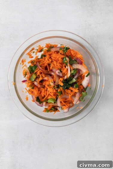 Buffalo Chicken Quesadilla Recipe 9 Carrot and onion salad in a glass bowl.