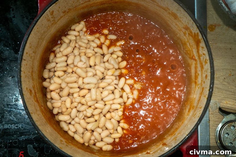 Adding the beans to the pot