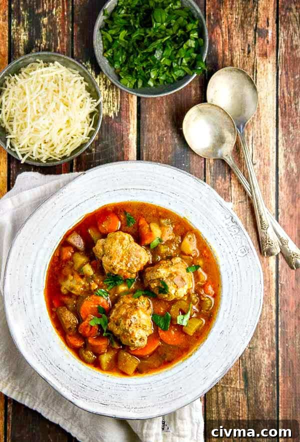 Close up of meatballs in a rich broth