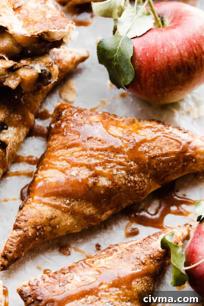 A close-up on a whole turnover, drizzled with salted caramel sauce.