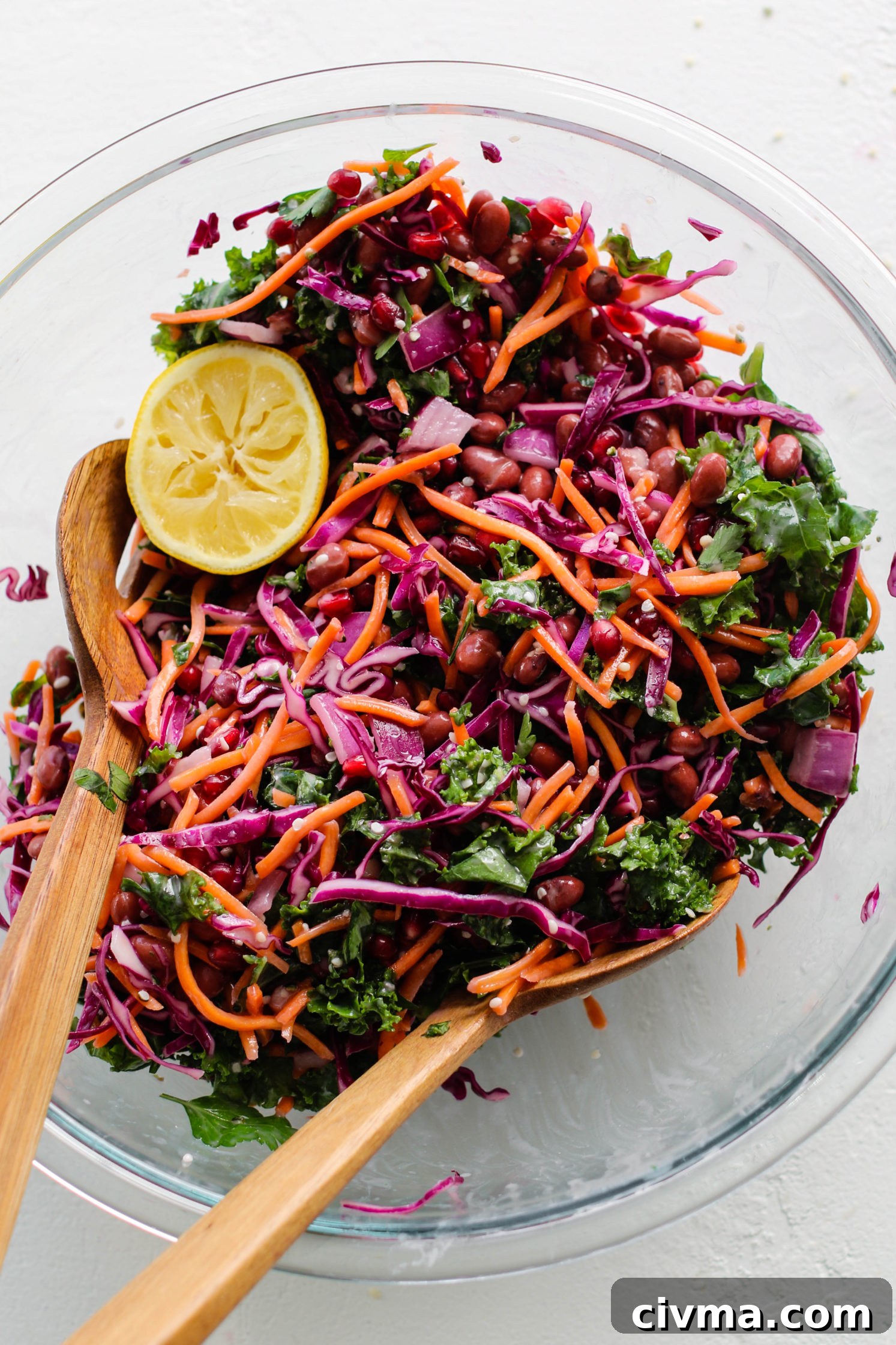 Red Bean and Pomegranate Salad Recipe 4 Red Bean & Pomegranate Salad in large glass bowl with two wooden salad forks