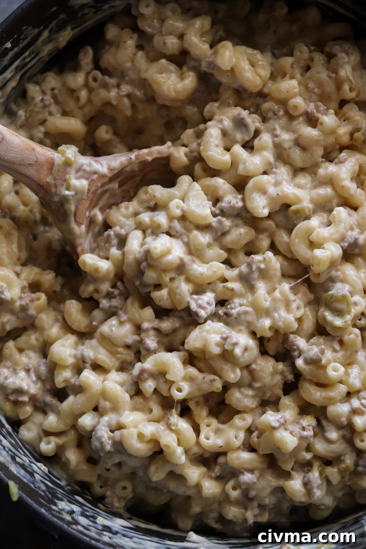 Serving of Hatch Green Chile Mac & Cheese with ground beef and melted cheese