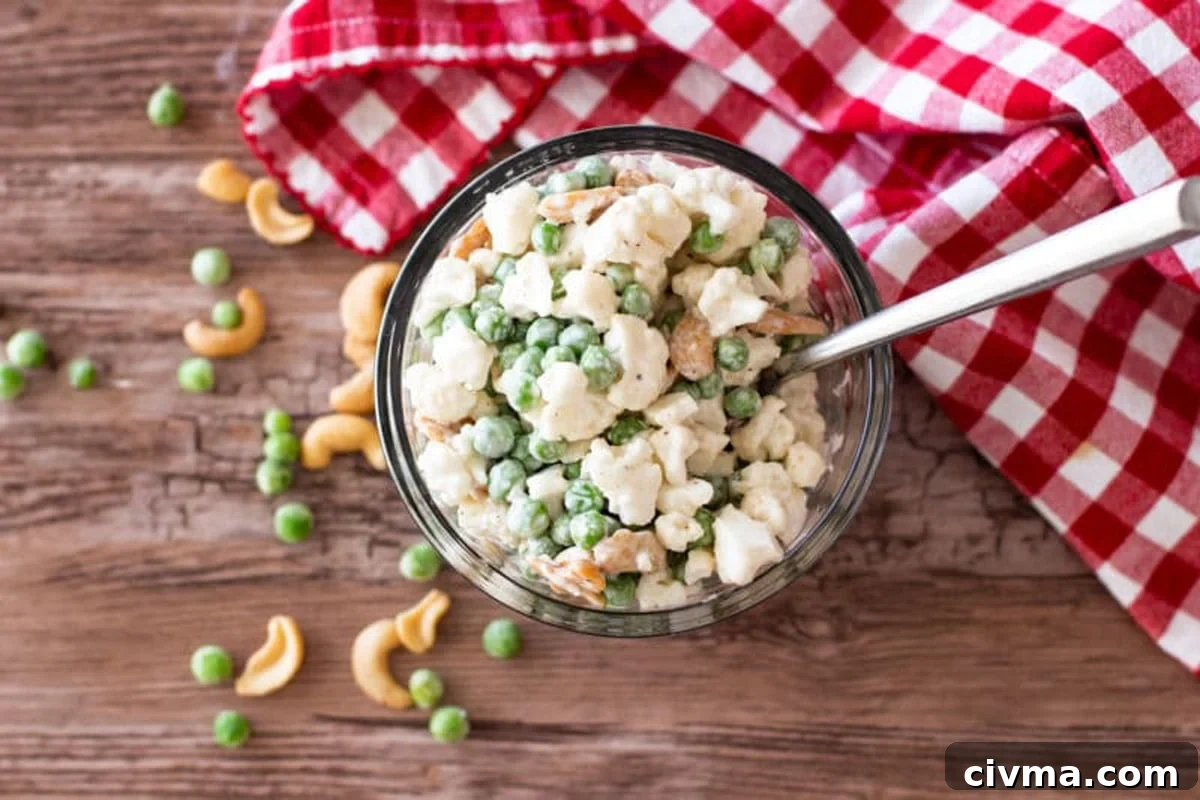 Summer salad in a glass jar on a table.