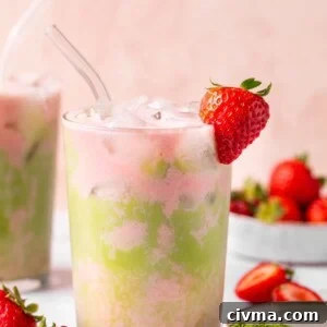 Iced Strawberry Matcha Latte Recipe 8 strawberry matcha tea over ice in a glass with a strawberry garnish