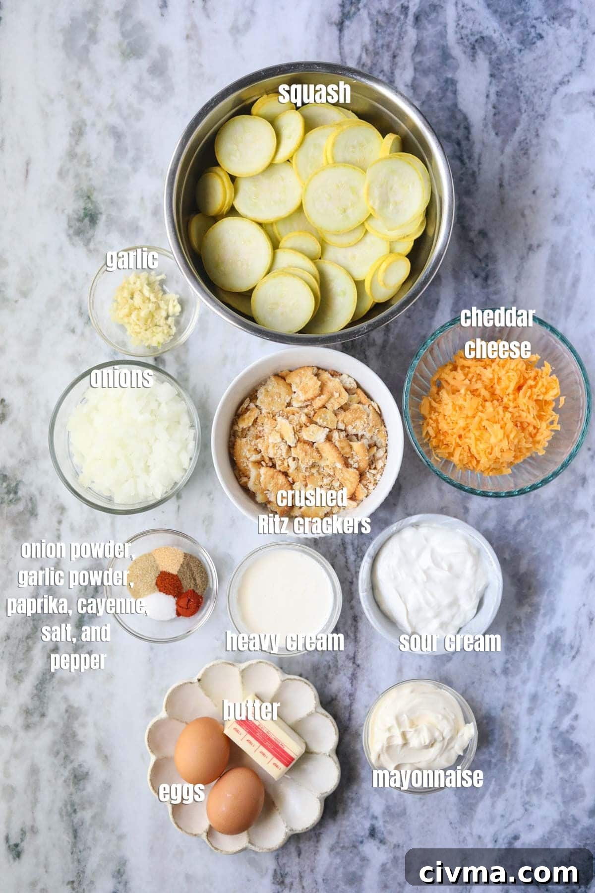 Ingredients for making southern squash casserole arranged on a marble countertop.