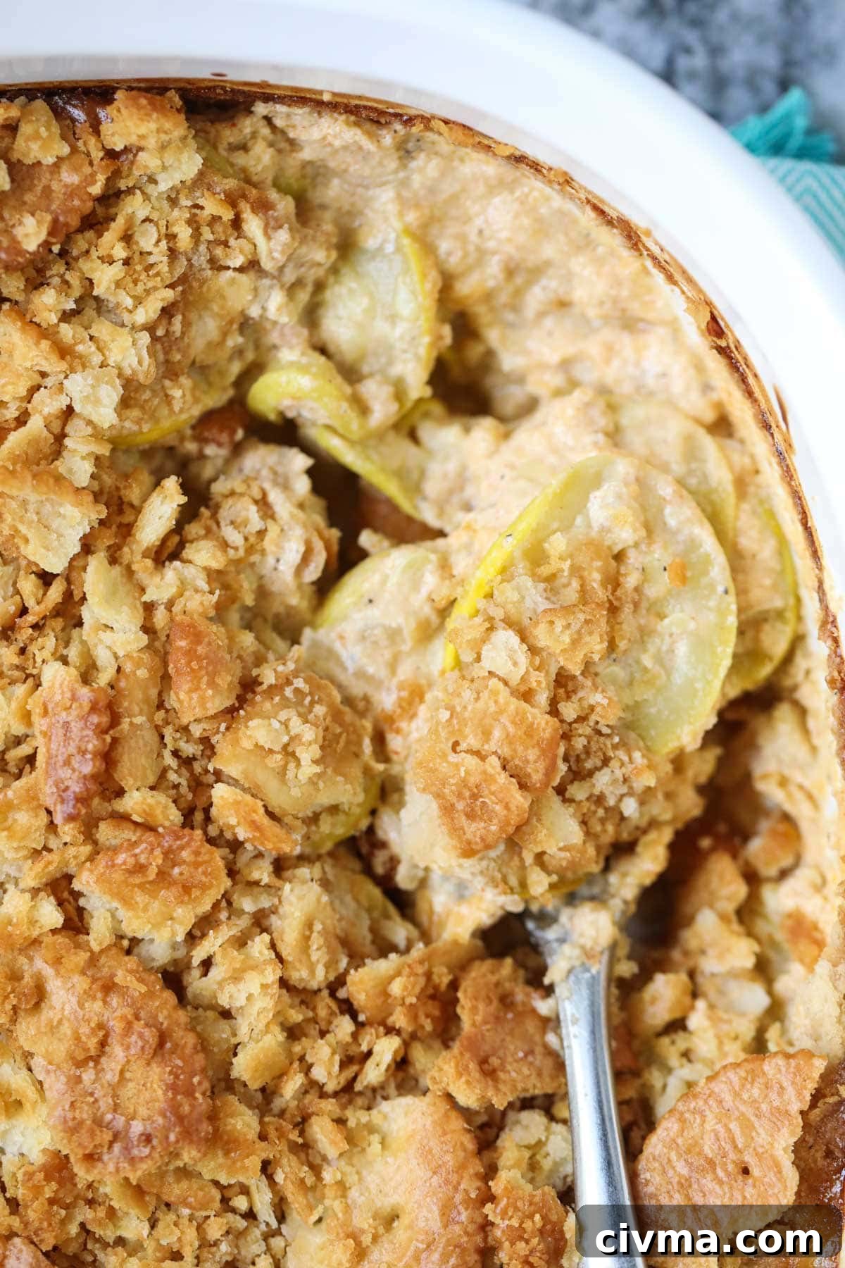 Southern squash casserole in a white baking dish.