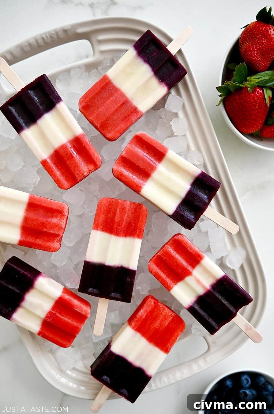 Red White and Blue Fruit Popsicles for the Fourth of July 2 A white platter topped with crushed ice and red, white and blue popsicles