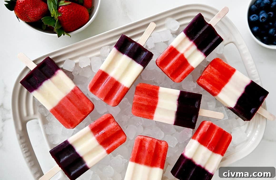 Red White and Blue Fruit Popsicles for the Fourth of July 5 A white platter topped with crushed ice and red, white and blue popsicles