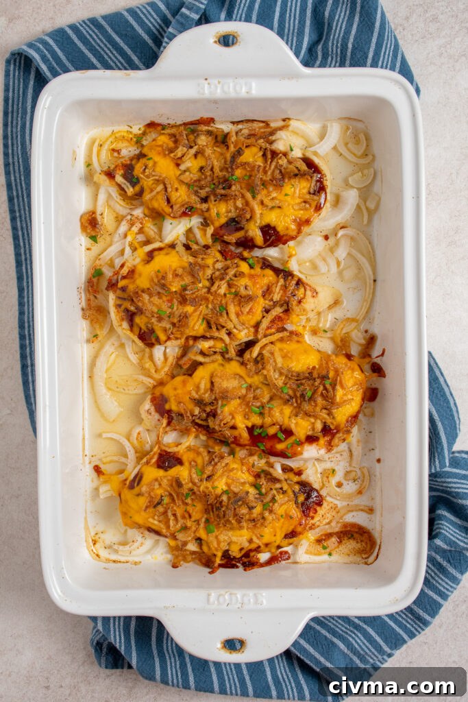 A casserole dish with cheesy BBQ chicken baked in the oven.