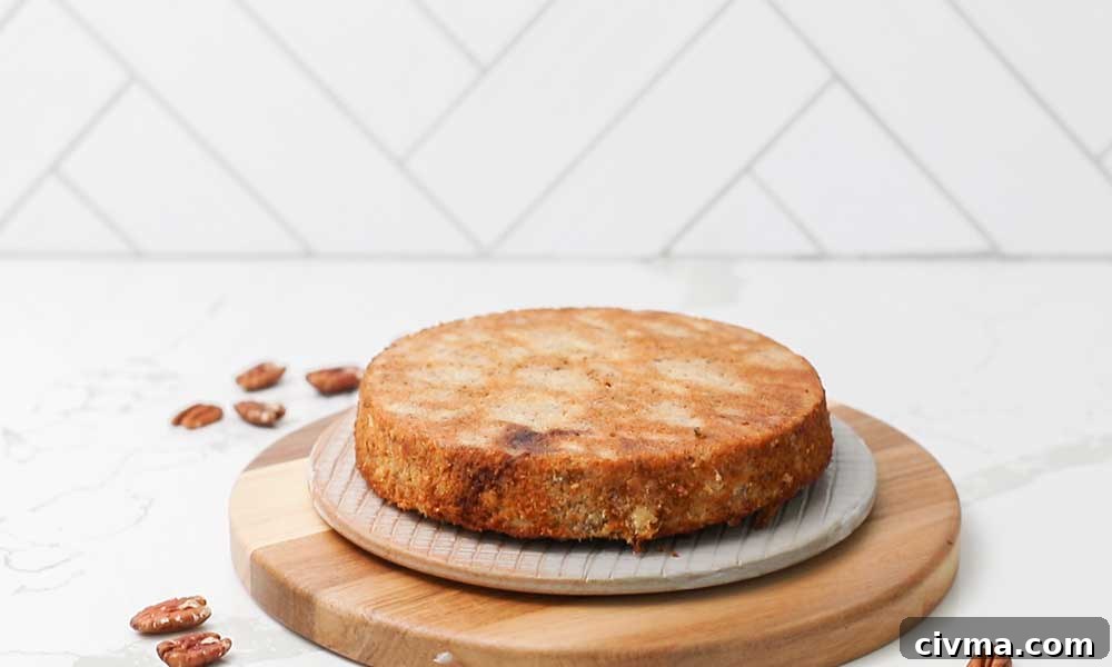 Placing the first layer of the cake on a platter.