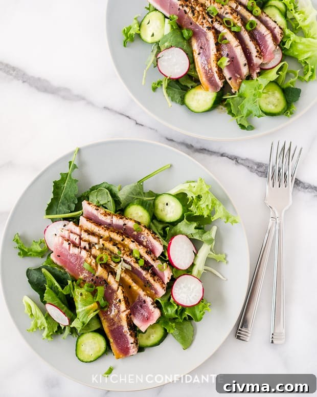 Seared Ahi Tuna Salad Plates Seared Ahi Tuna Salad served on large white plates.