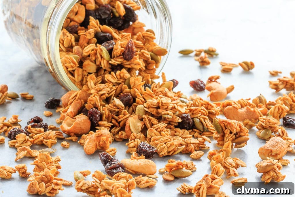 Homemade pumpkin spice granola served as a healthy breakfast or snack with yogurt.