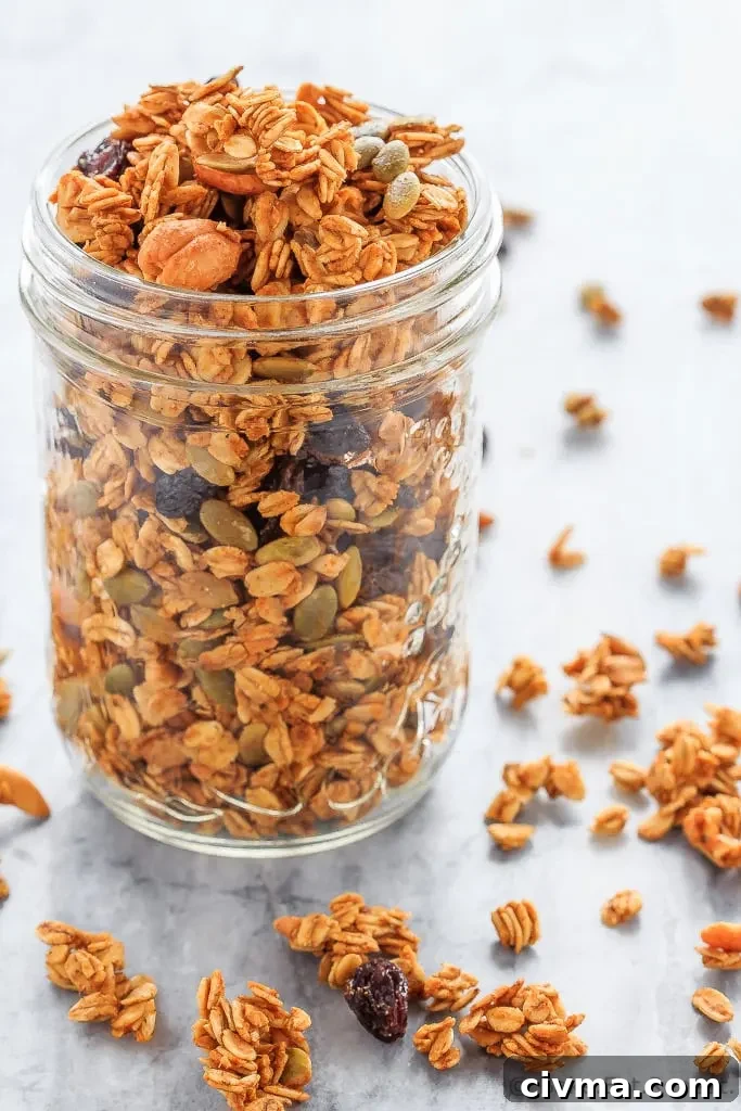 A bowl of homemade pumpkin spice granola ready to serve with yogurt.