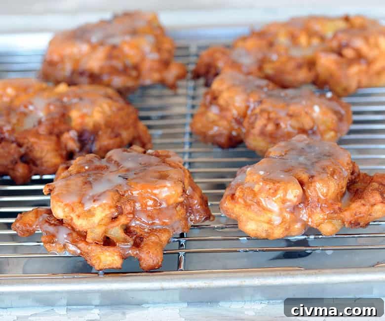 bacon apple fritters resting on cooking rack