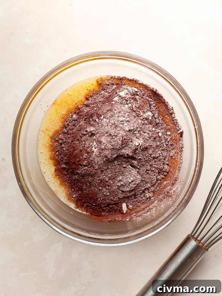 Gluten Free Air Fryer Chocolate Cake Recipe 7 dry ingredients added to the wet ingredients for gluten free air fryer chocolate cake