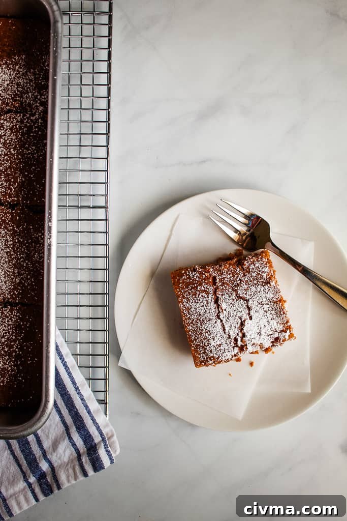 gluten free gingerbread slice on a white plate
