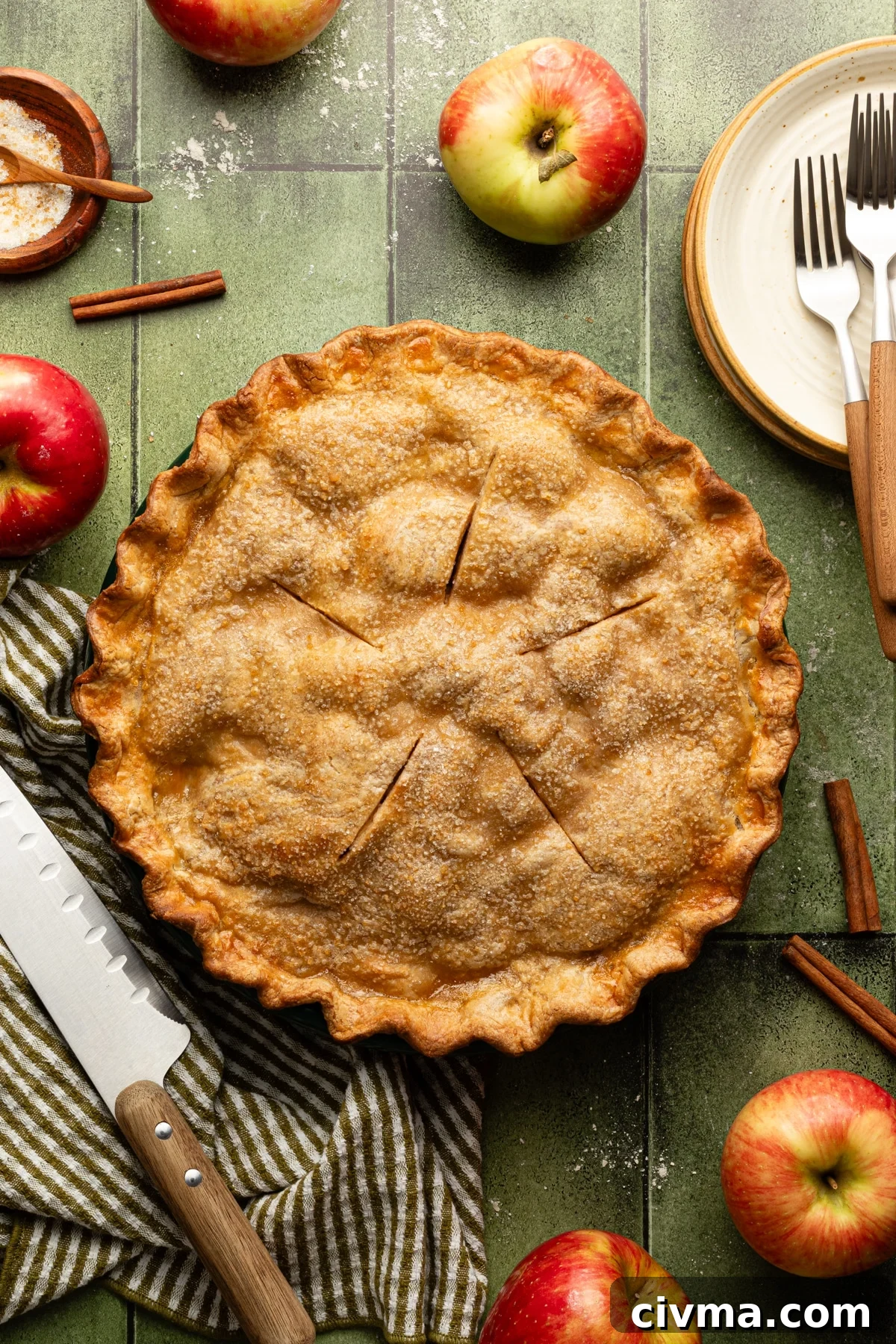 Apple Pie Recipe with Less Sugar and Flaky Crust 12 Baked healthy apple pie on a green tablescape.