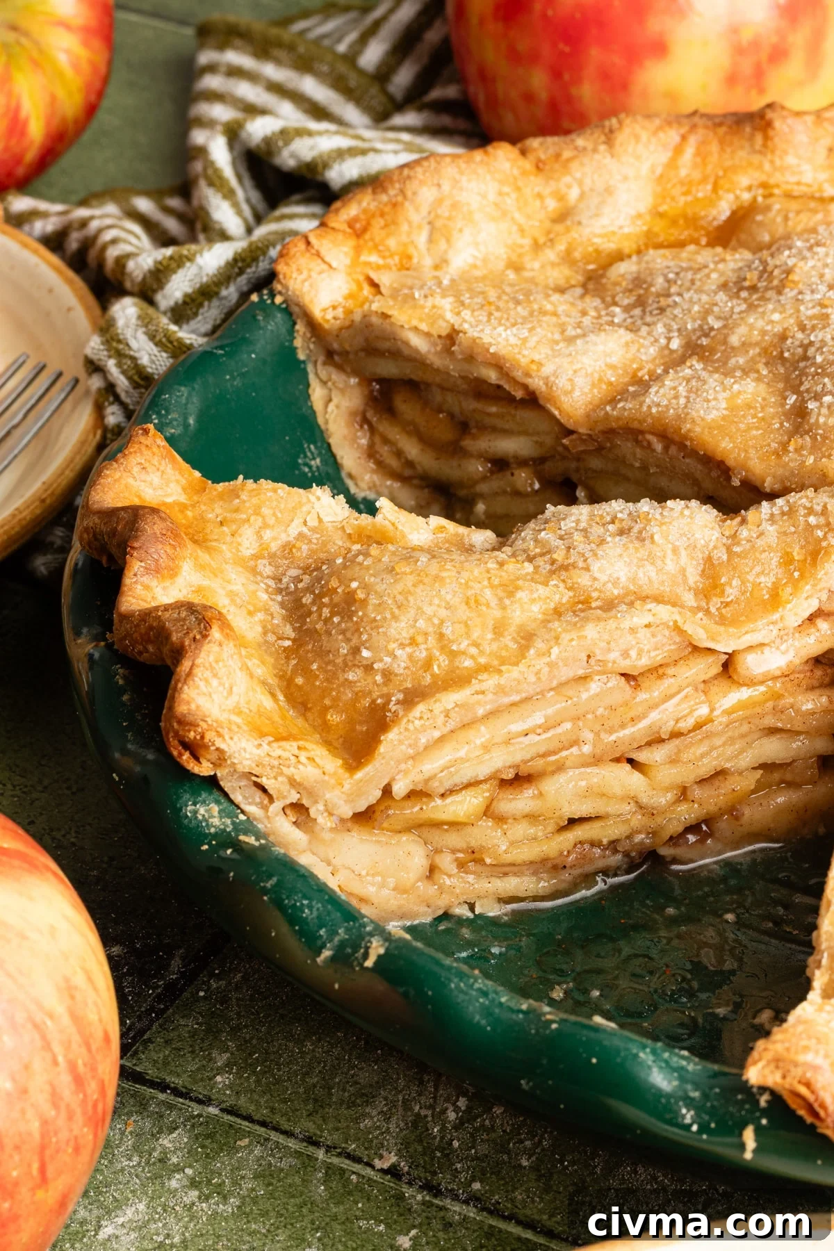 Apple Pie Recipe with Less Sugar and Flaky Crust 13 Healthy apple pie sliced in a pie dish.