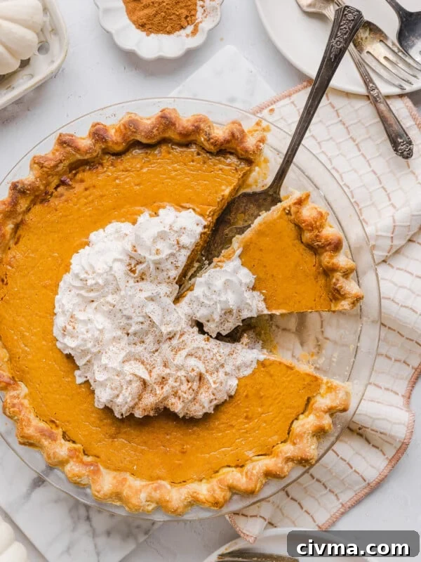 Healthy pumpkin pie topped with whipped cream.