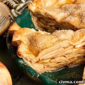 Healthy apple pie sliced in a pie dish.