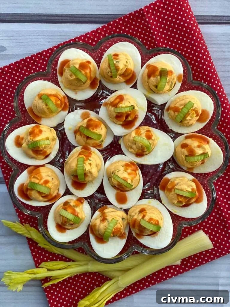 Tray of Buffalo deviled eggs garnished with celery